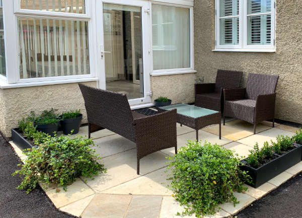 Outdoor seating area and secure gated parking at our Cirencester bed and breakfast